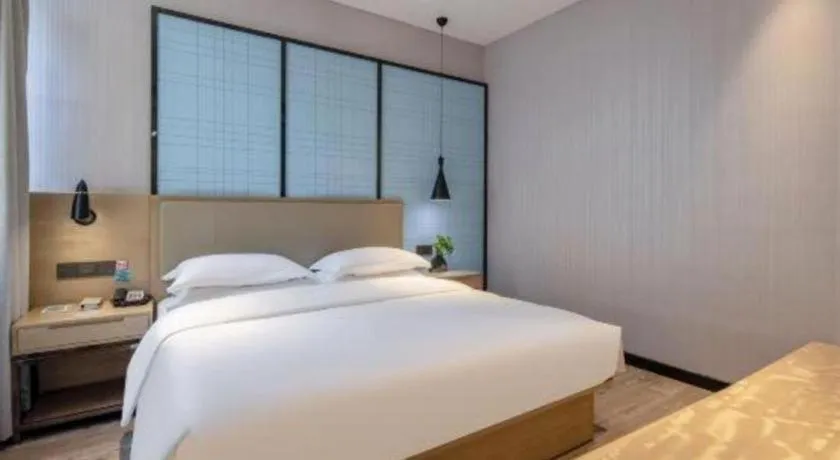 Bed in Echarm Hotel Baise Sports Center Dream Island Plaza