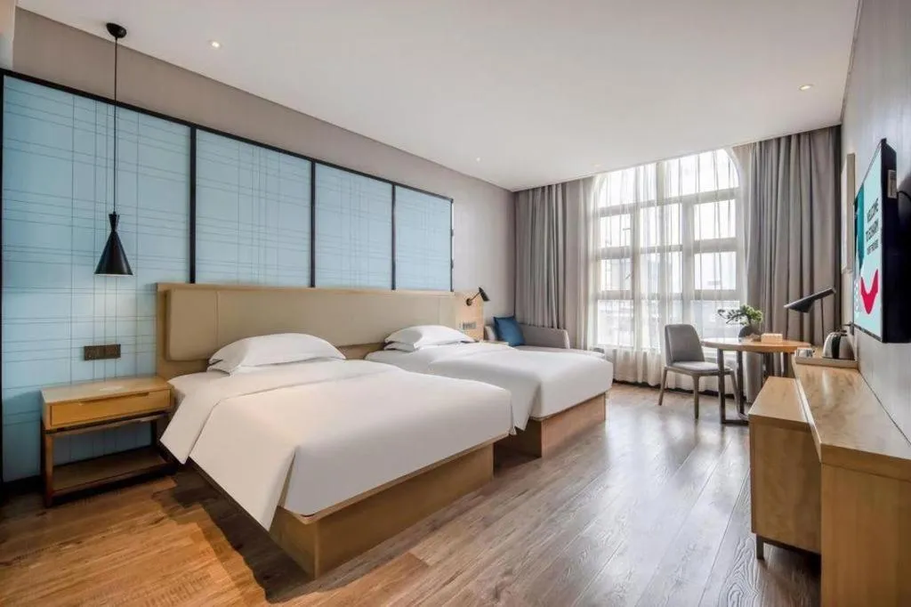 Bed in Echarm Hotel Baise Sports Center Dream Island Plaza