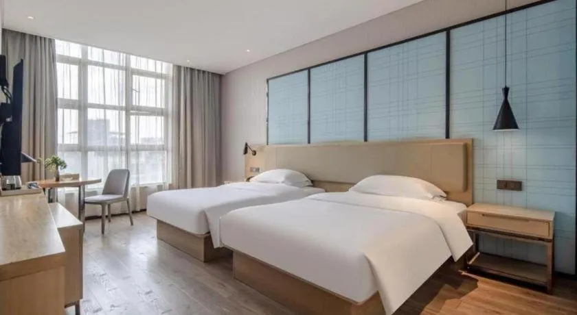 Bed in Echarm Hotel Baise Sports Center Dream Island Plaza