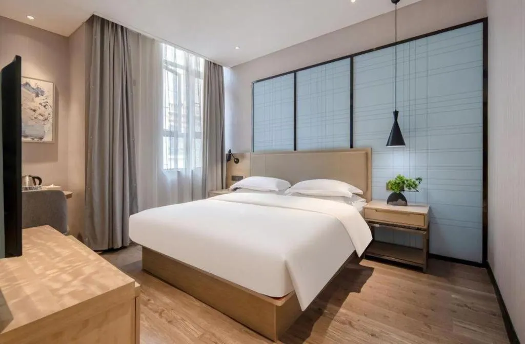 Bed in Echarm Hotel Baise Sports Center Dream Island Plaza