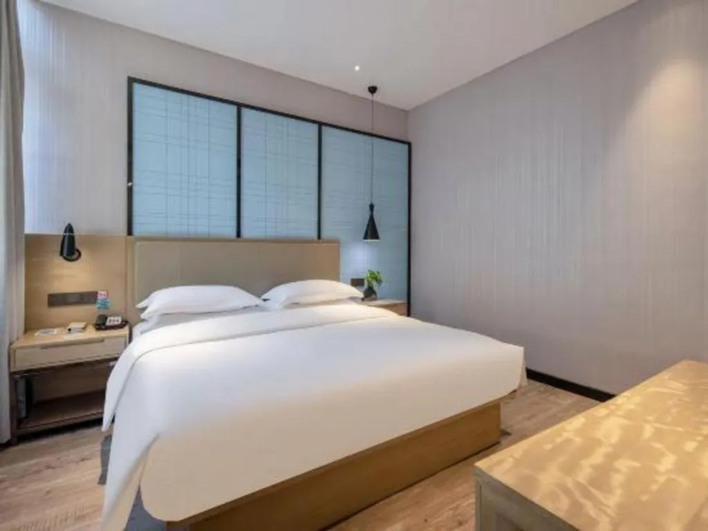 Bed in Echarm Hotel Baise Sports Center Dream Island Plaza