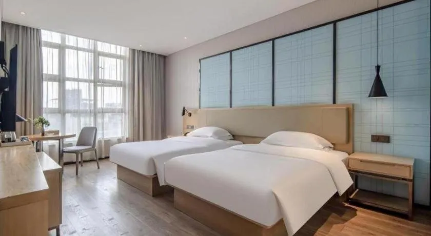 Bed in Echarm Hotel Baise Sports Center Dream Island Plaza