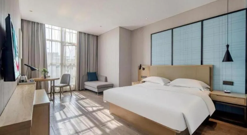 Bed in Echarm Hotel Baise Sports Center Dream Island Plaza