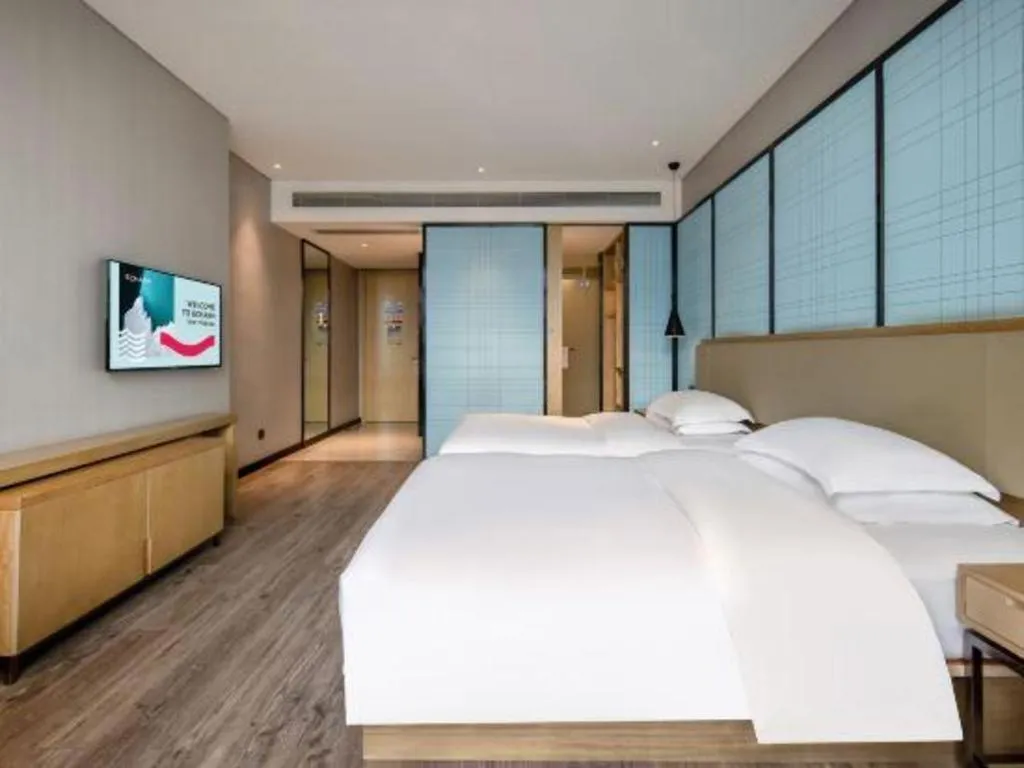 Bed in Echarm Hotel Baise Sports Center Dream Island Plaza