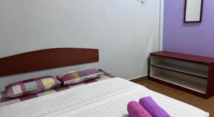 Bed in OYO 90967 Homestay Chalet Warisan Siti
