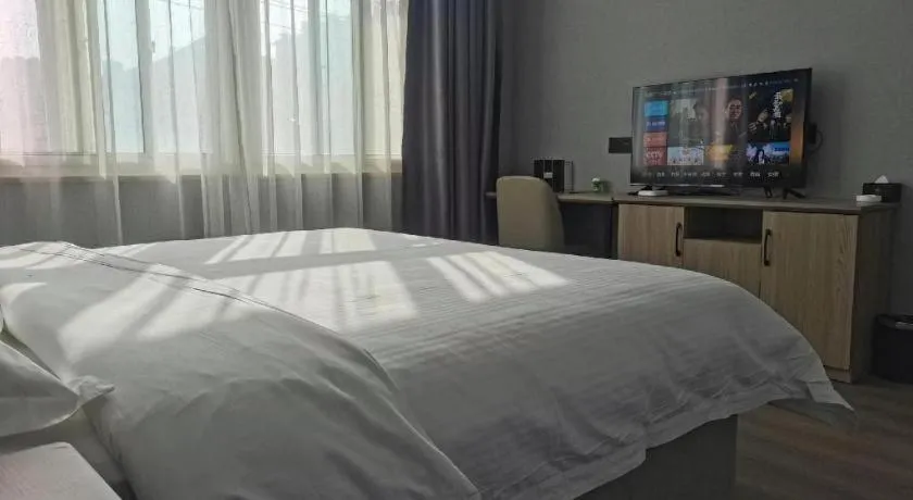 Bed in GreenTree Inn Anqing Tongcheng South Shengtang Road Shengtang International Business Hotel