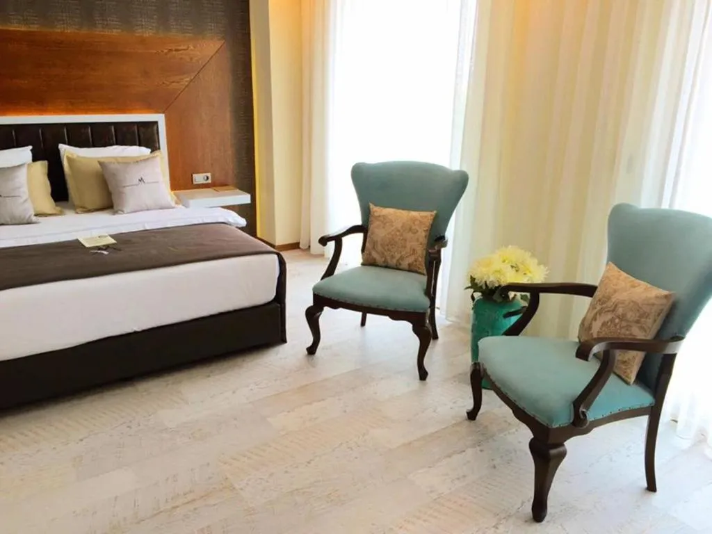 Bed in Maison Vourla Hotel