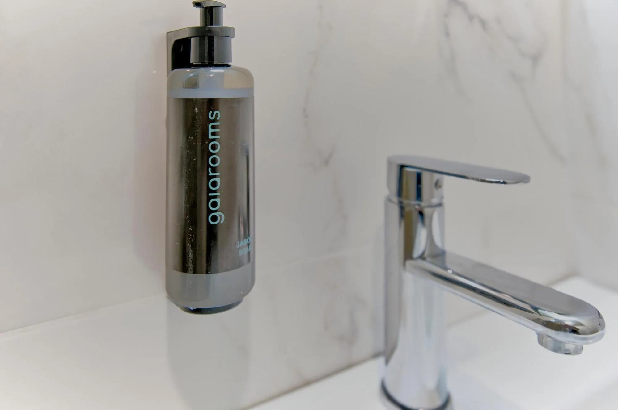 Bathroom in Apartamentos Olivia by gaiarooms