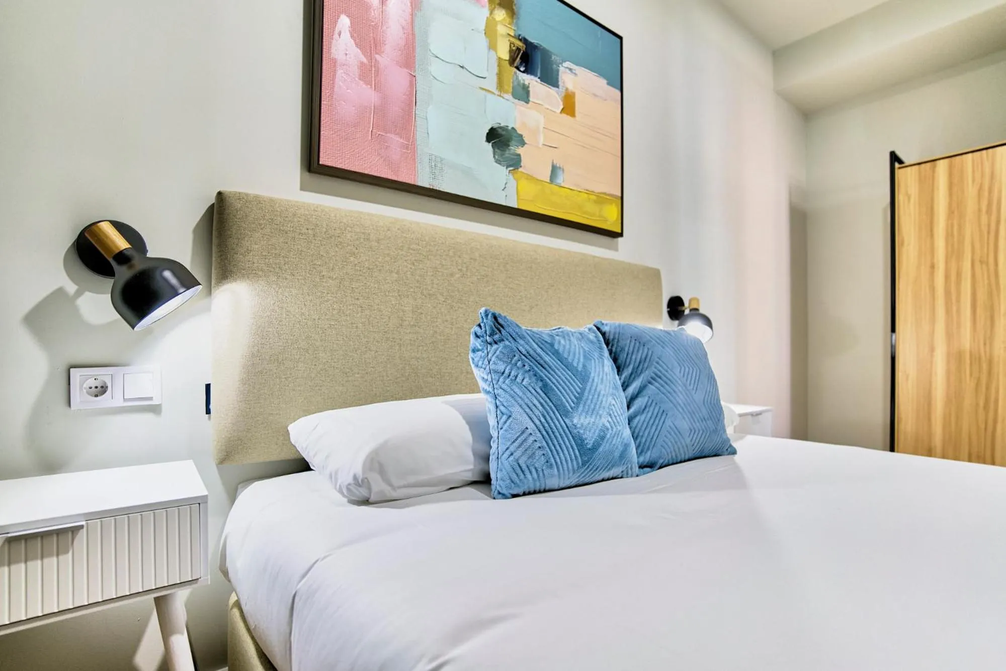 Bed in Apartamentos Olivia by gaiarooms