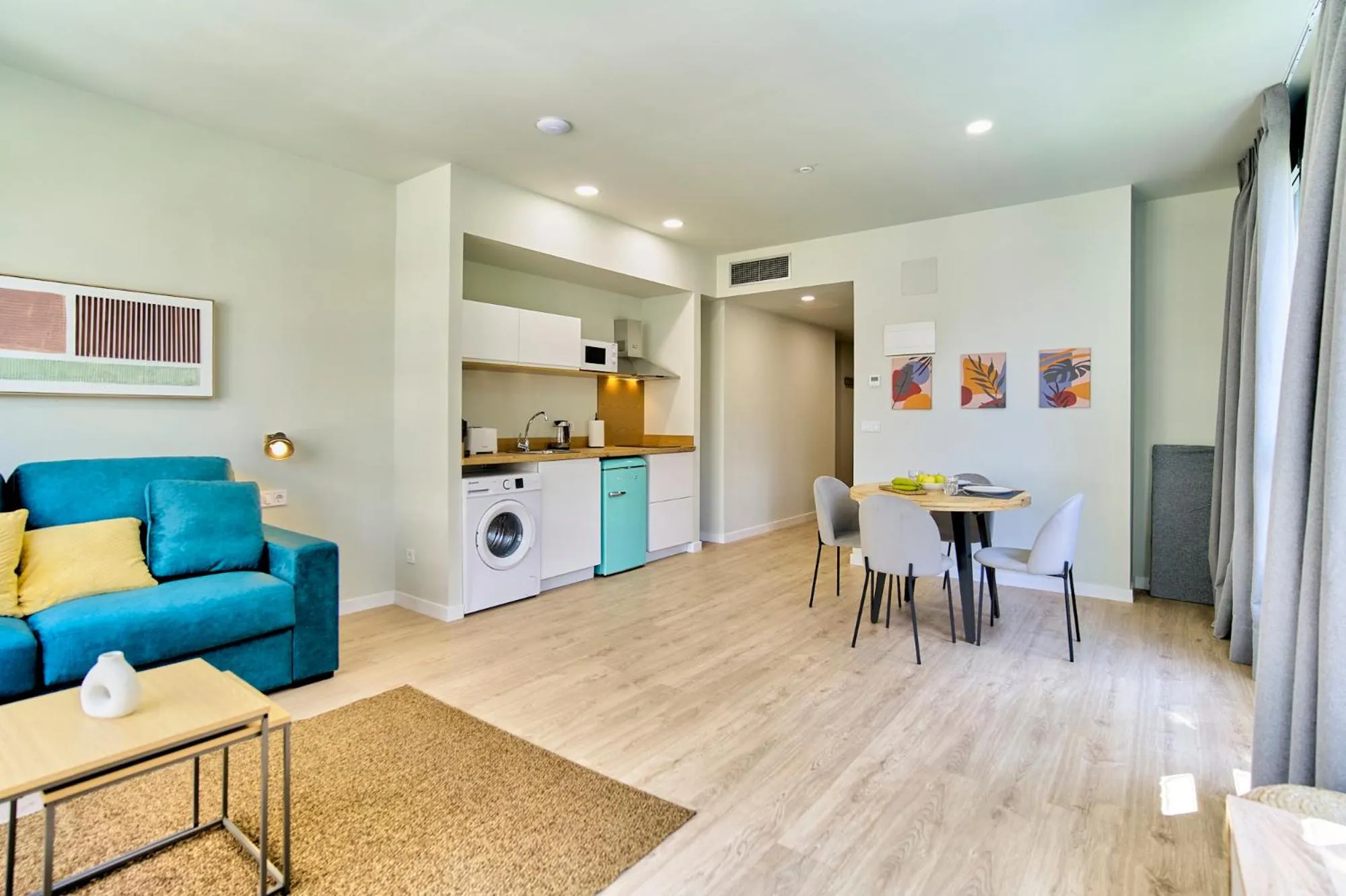 Living room in Apartamentos Olivia by gaiarooms