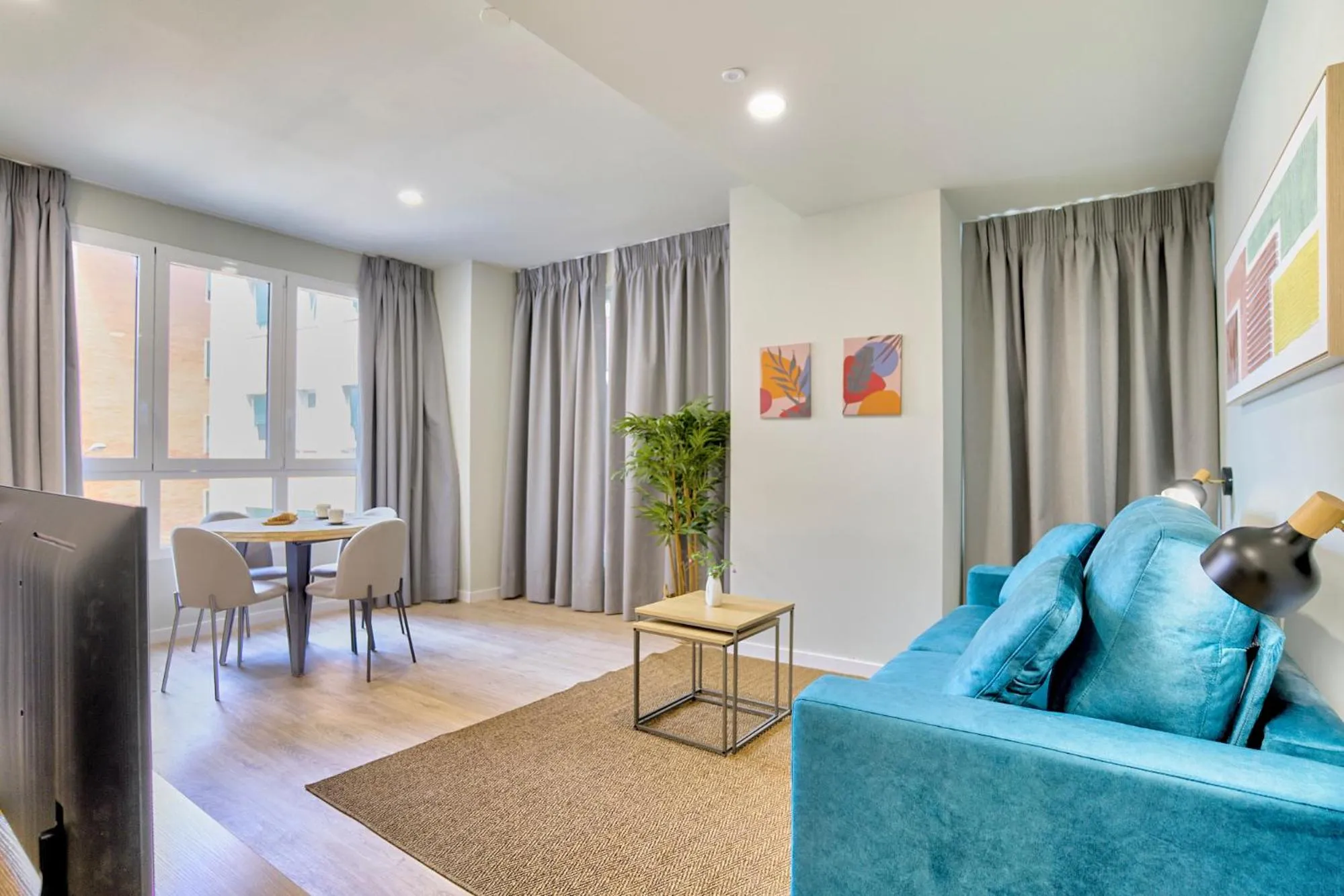 Living room in Apartamentos Olivia by gaiarooms