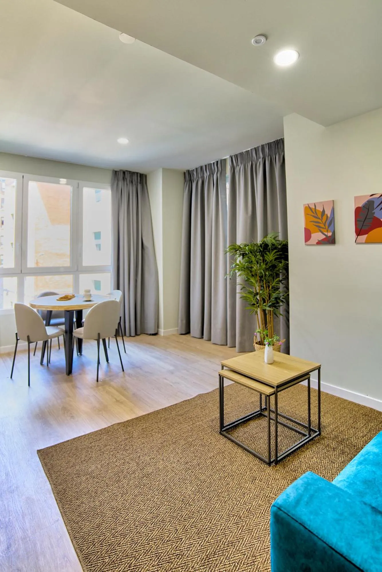 Living room in Apartamentos Olivia by gaiarooms