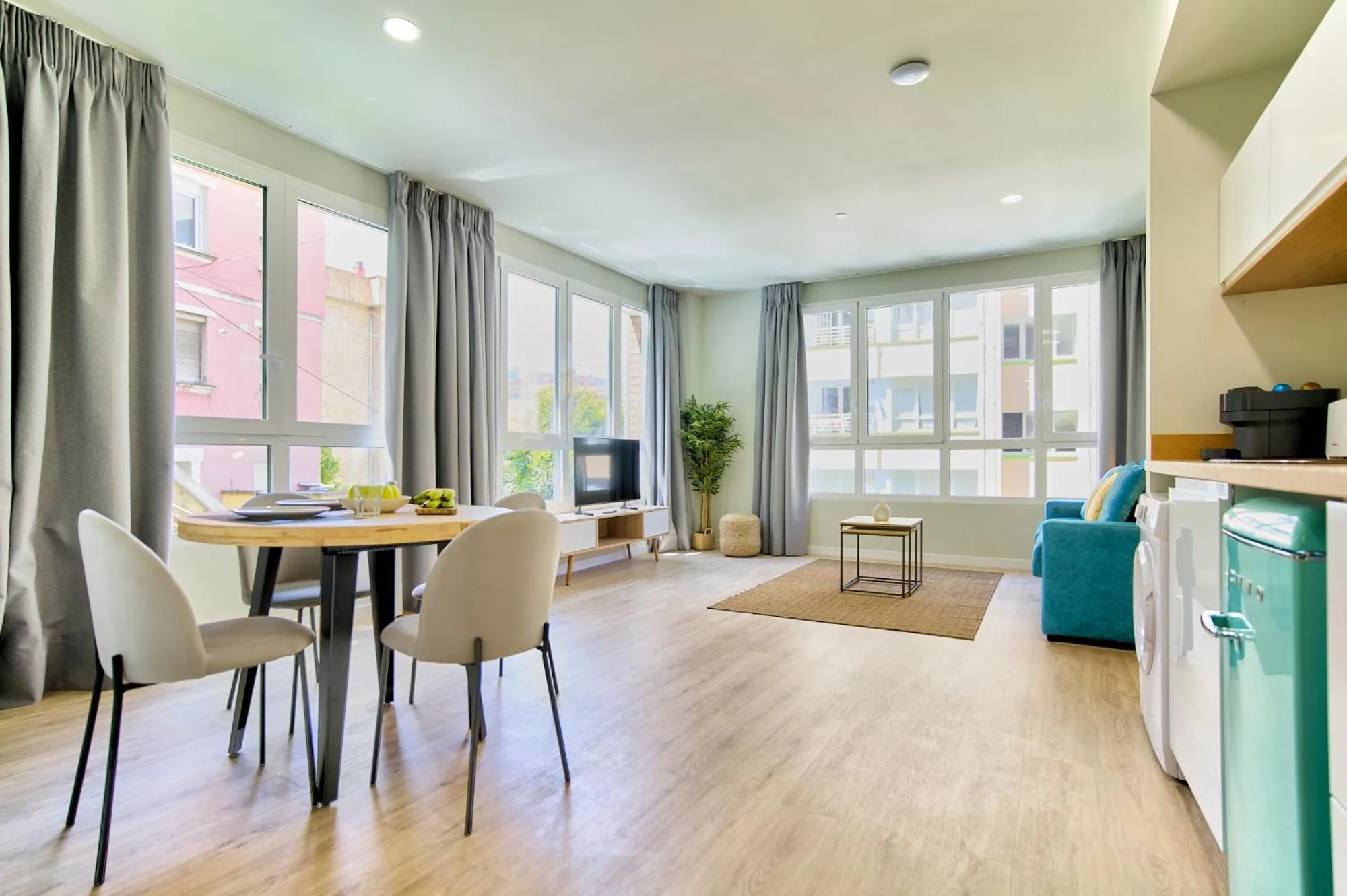 Living room in Apartamentos Olivia by gaiarooms