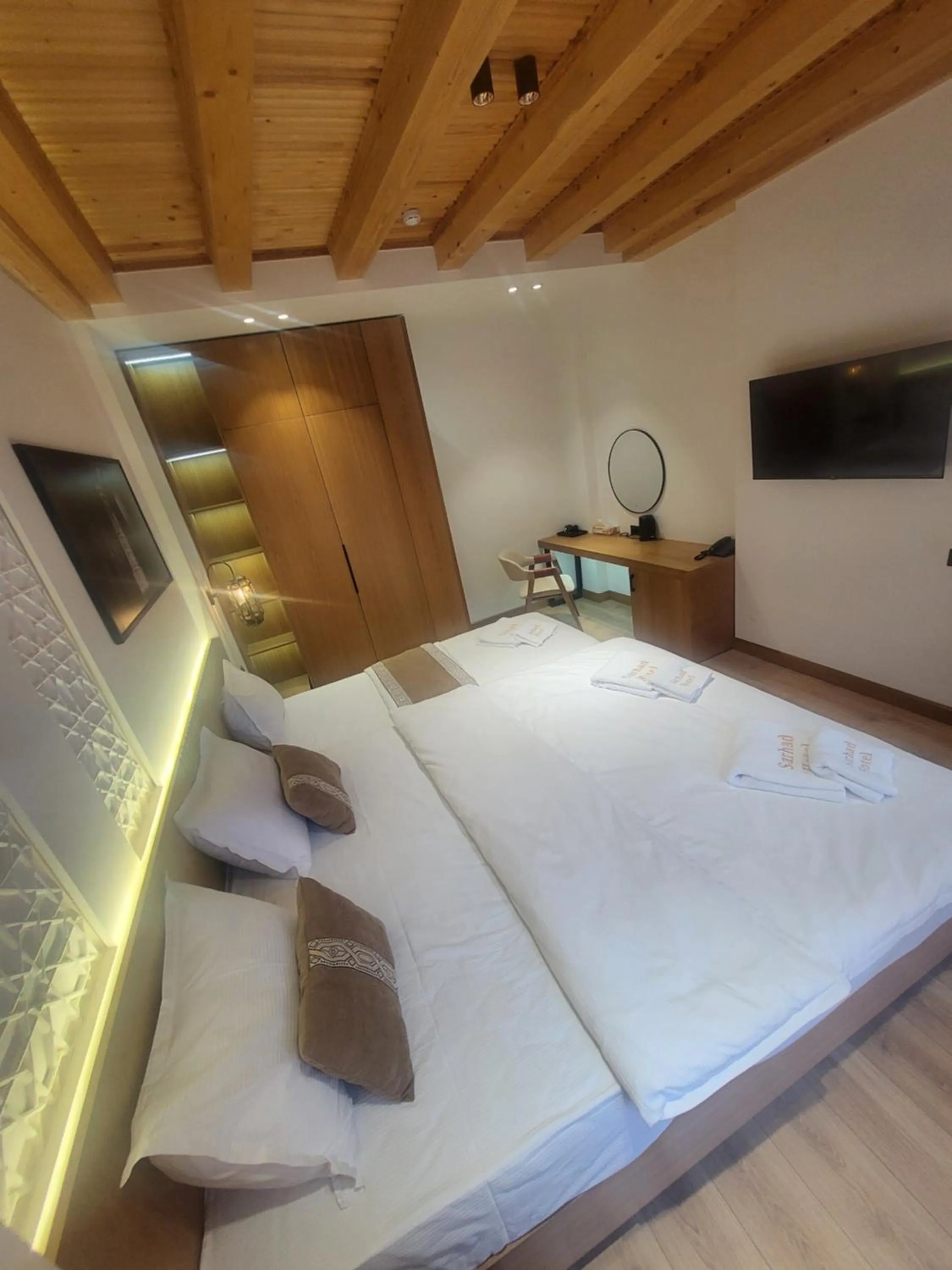 Communal lounge/ TV room, Bed in Sarhad Hotel