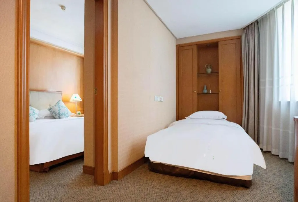 Bed in Haihua Hotel Hangzhou