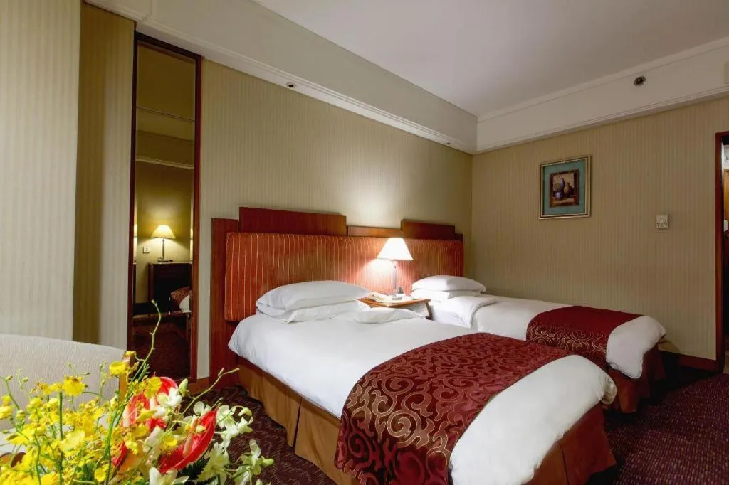 Bed in Haihua Hotel Hangzhou