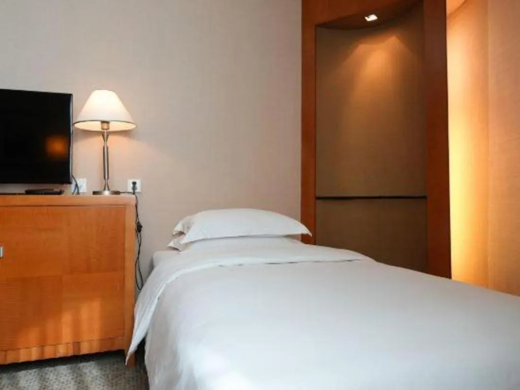 Bed in Haihua Hotel Hangzhou