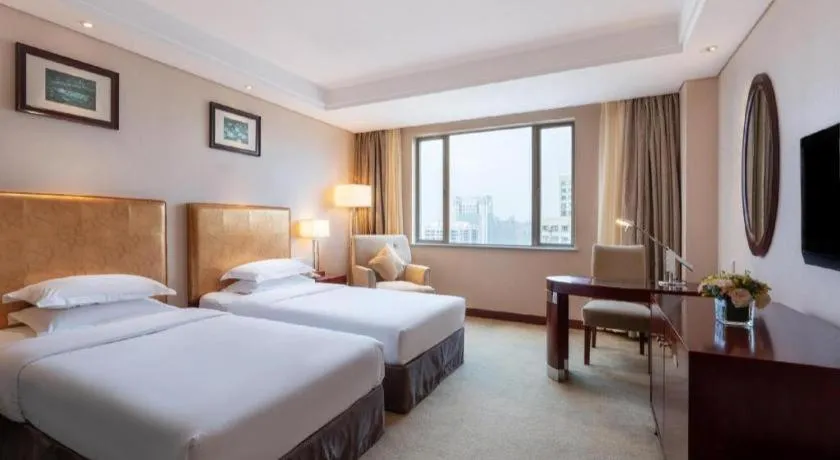 Bed in Maison New Century Hotel Ningbo