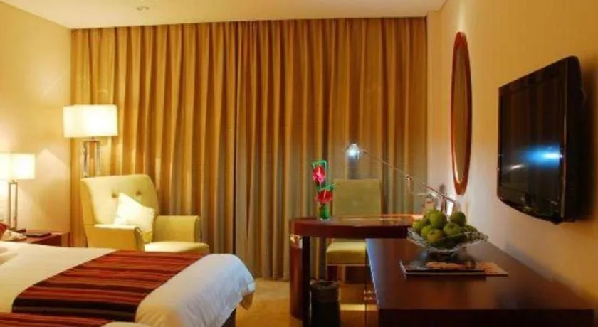 Bed in Maison New Century Hotel Ningbo