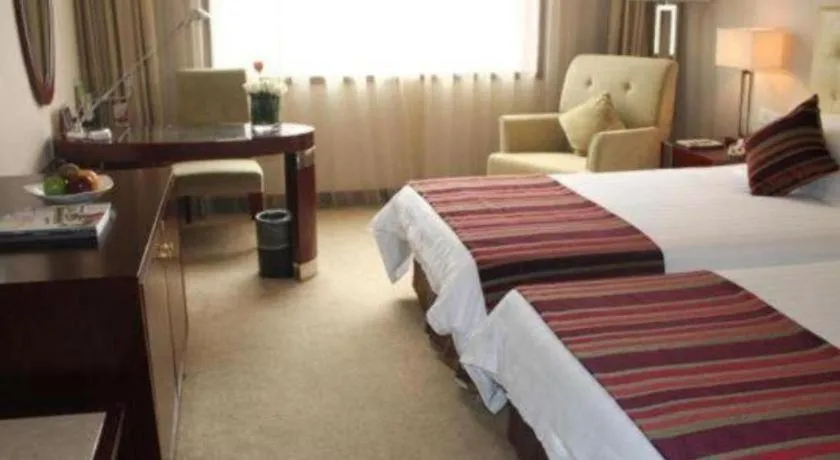 Bed in Maison New Century Hotel Ningbo