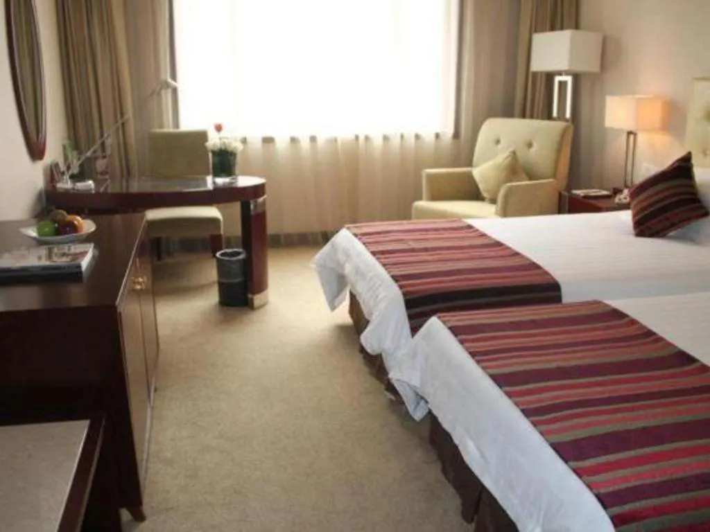 Bed in Maison New Century Hotel Ningbo