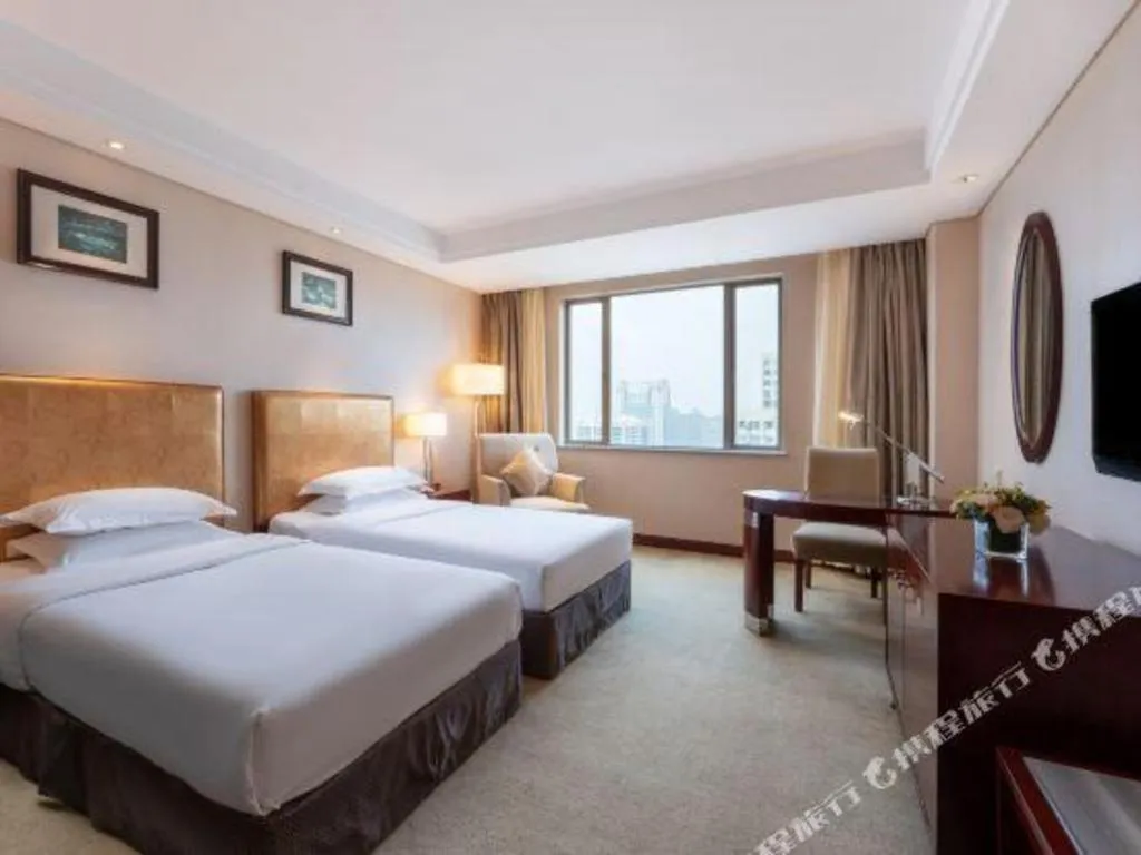 Bed in Maison New Century Hotel Ningbo