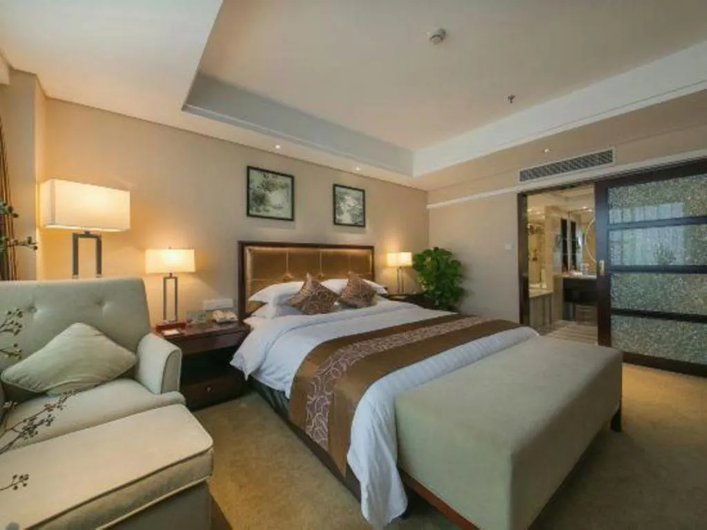 Bed in Maison New Century Hotel Ningbo