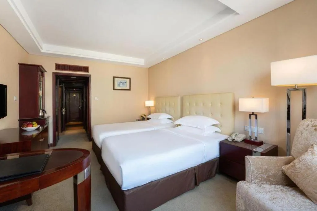 Bed in Maison New Century Hotel Ningbo