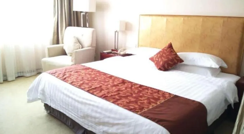 Bed in Maison New Century Hotel Ningbo