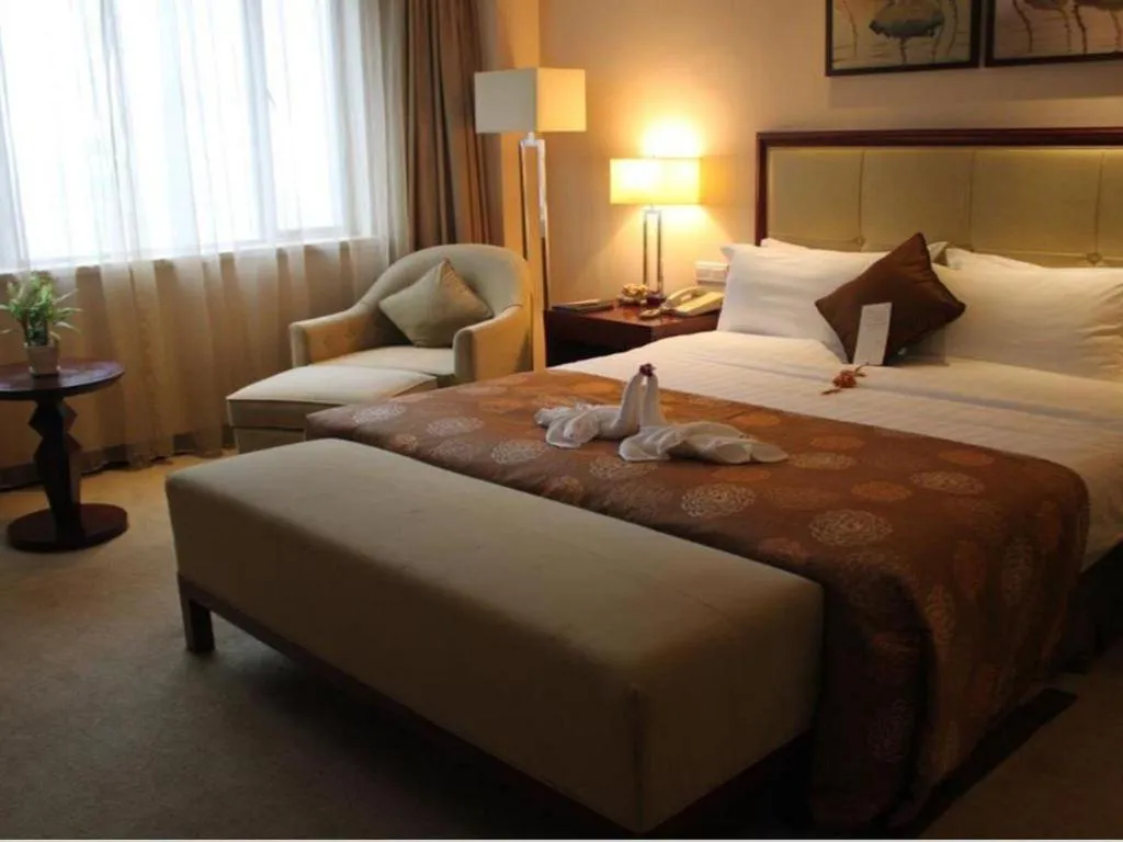 Bed in Maison New Century Hotel Ningbo