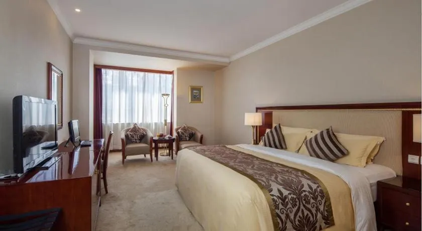 Bed in Xinhai Jinjiang Hotel