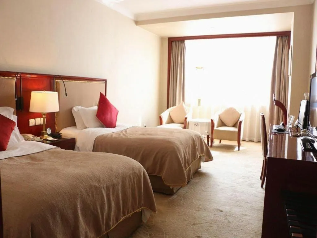 Bed in Xinhai Jinjiang Hotel