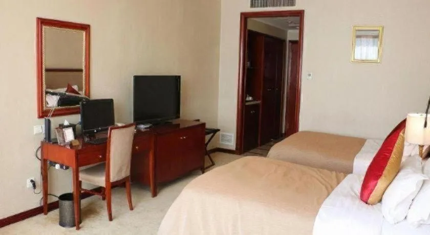 Bed in Xinhai Jinjiang Hotel