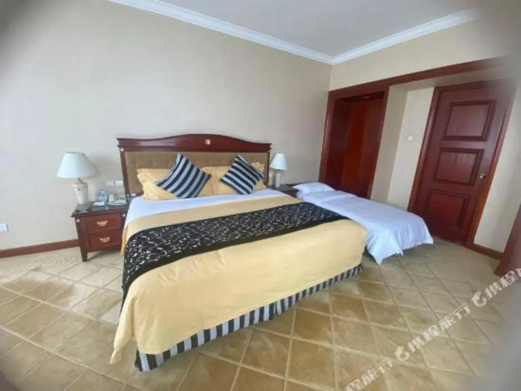 Bed in Xinhai Jinjiang Hotel