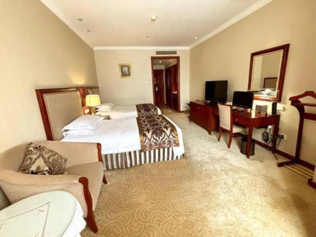 Bed in Xinhai Jinjiang Hotel