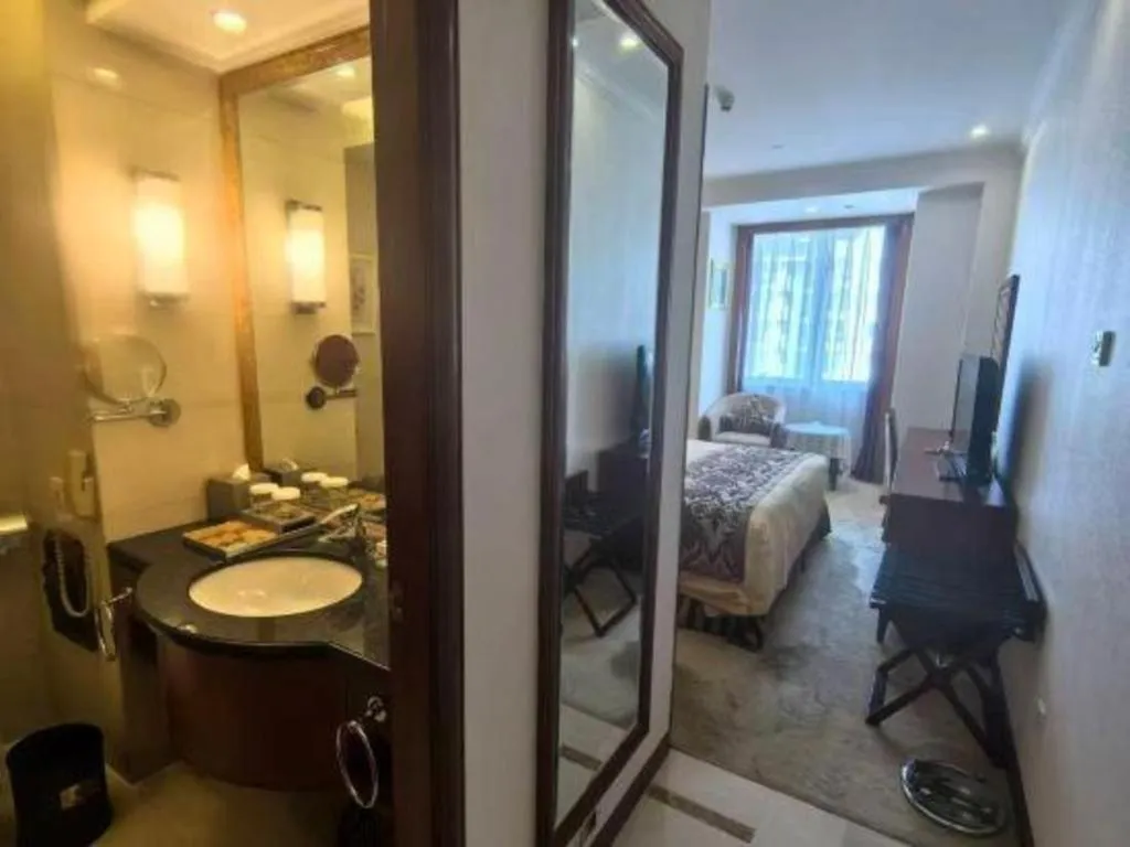 Bed in Xinhai Jinjiang Hotel