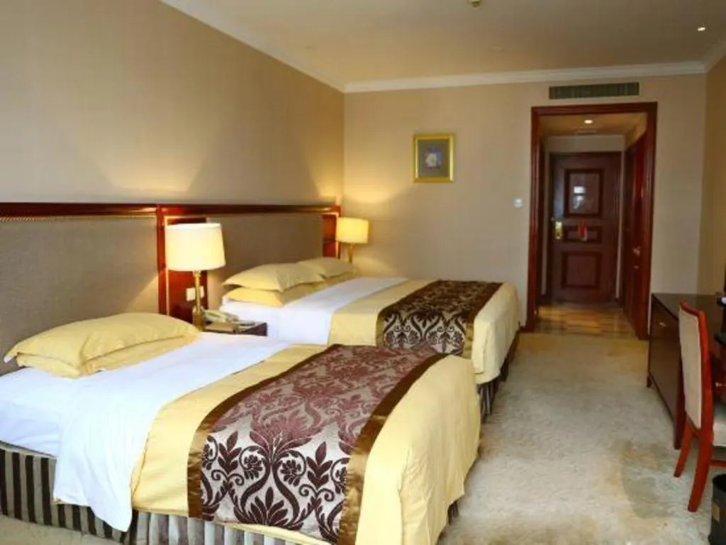 Bed in Xinhai Jinjiang Hotel