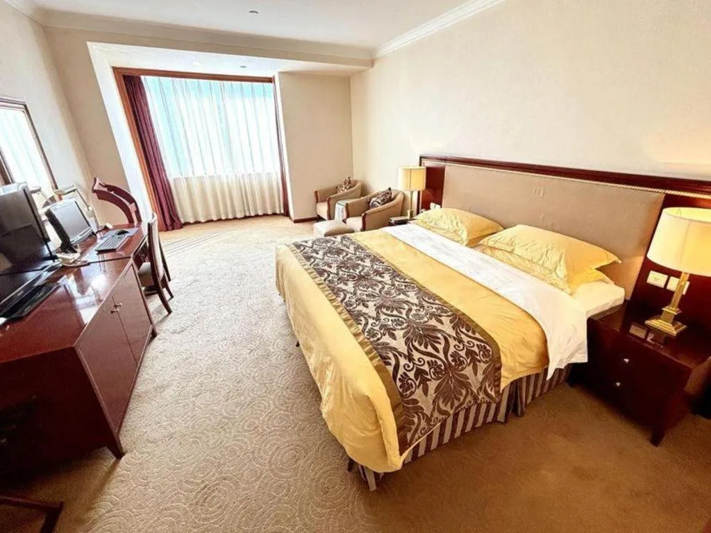 Bed in Xinhai Jinjiang Hotel