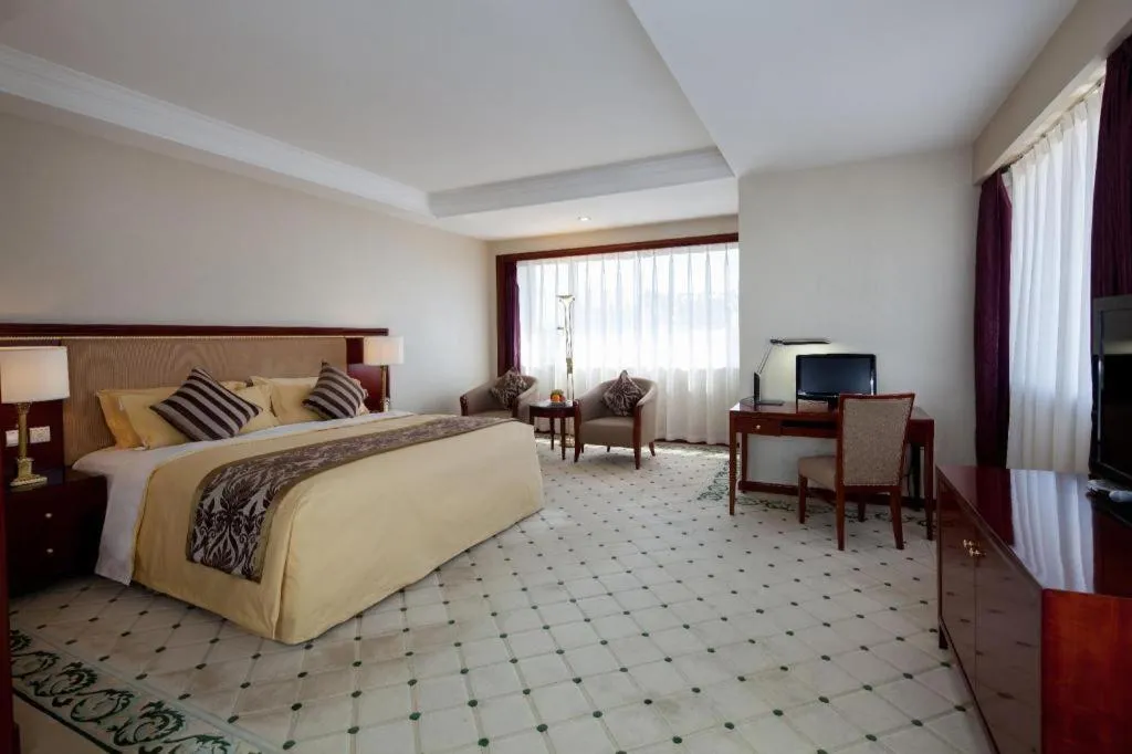 Bed in Xinhai Jinjiang Hotel