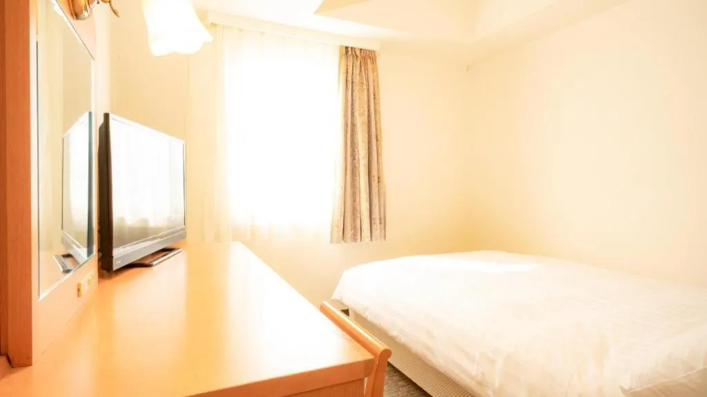 Bed in Smile Hotel Nishiakashi