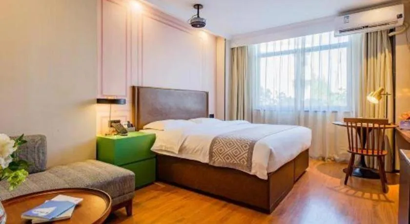 Bed in GME NanJing CaoChanGMEn Nanyihou Stress Hotel