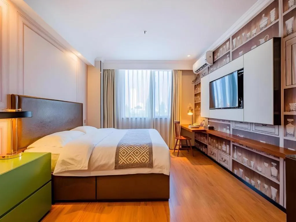 Bed in GME NanJing CaoChanGMEn Nanyihou Stress Hotel