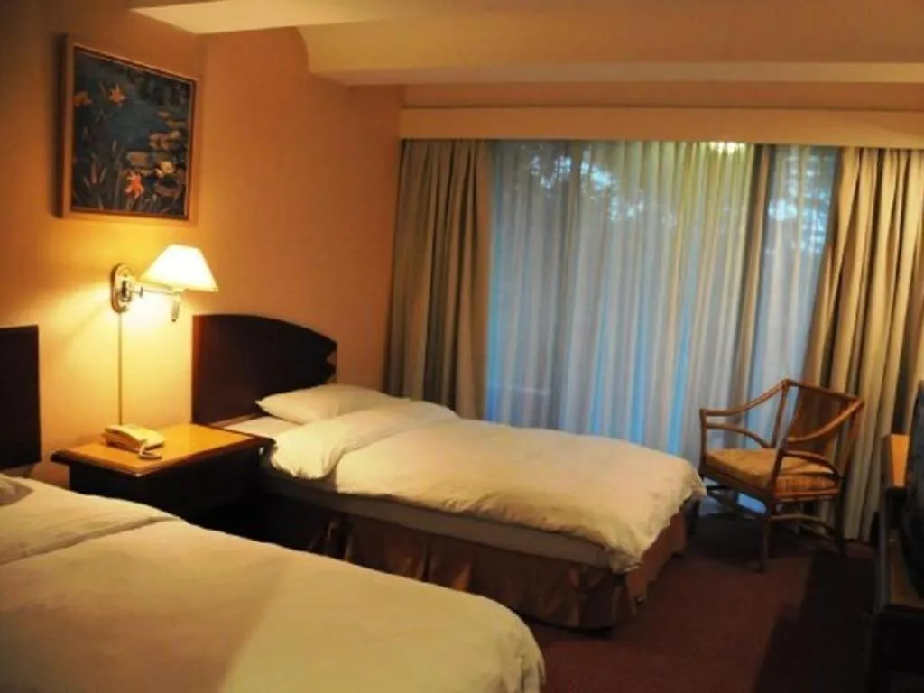 Bed in Casuarina Hotel