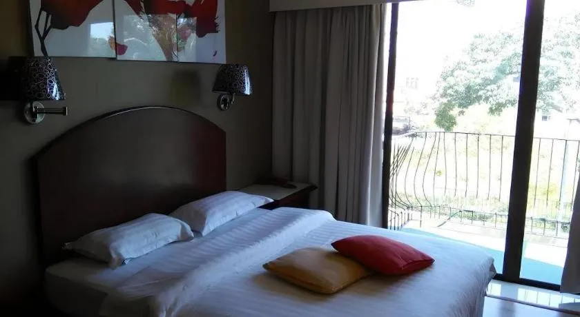 Bed in Casuarina Hotel