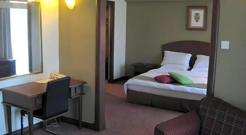 Bed in Casuarina Hotel