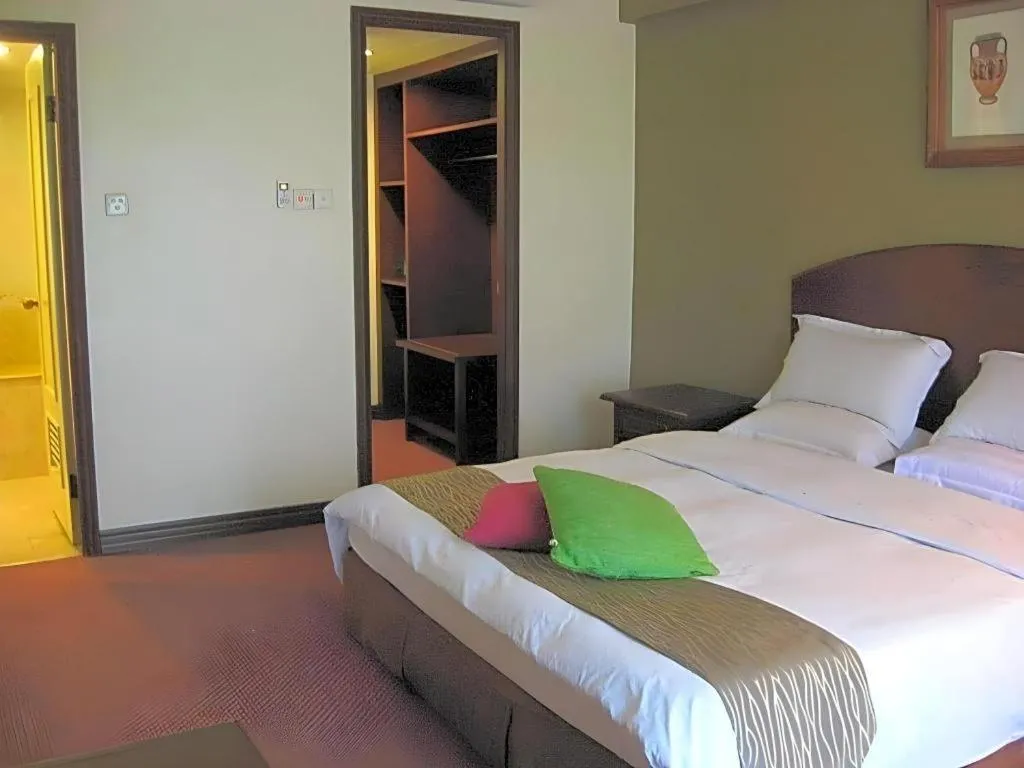 Bed in Casuarina Hotel