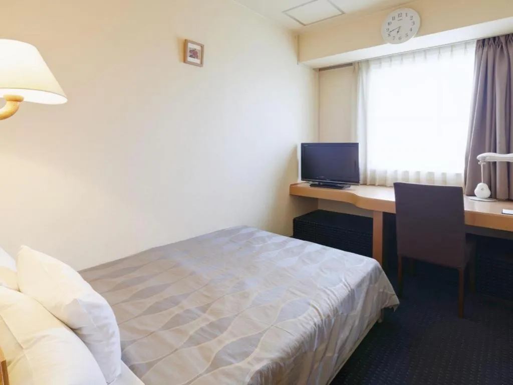 Bed in Roco Inn Matsuyama