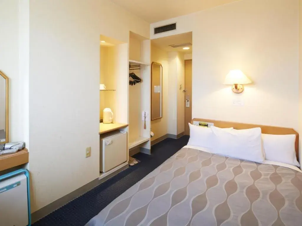 Bed in Roco Inn Matsuyama Bed in Roco Inn Matsuyama