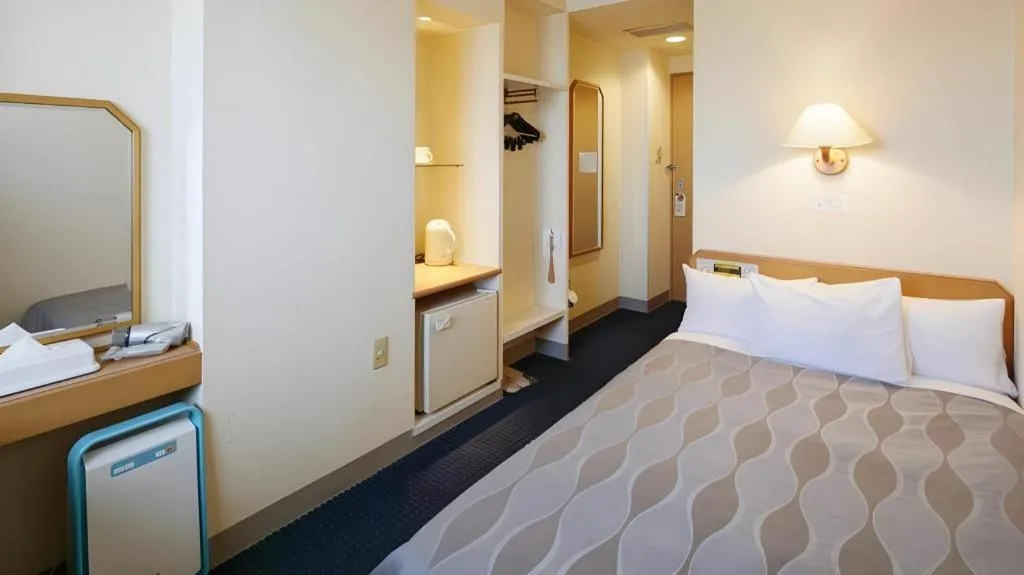 Bed in Roco Inn Matsuyama