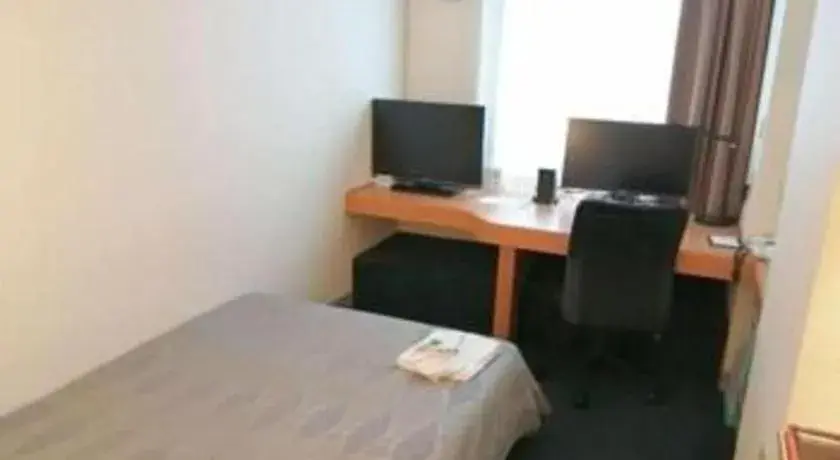 Bed in Roco Inn Matsuyama Bed in Roco Inn Matsuyama